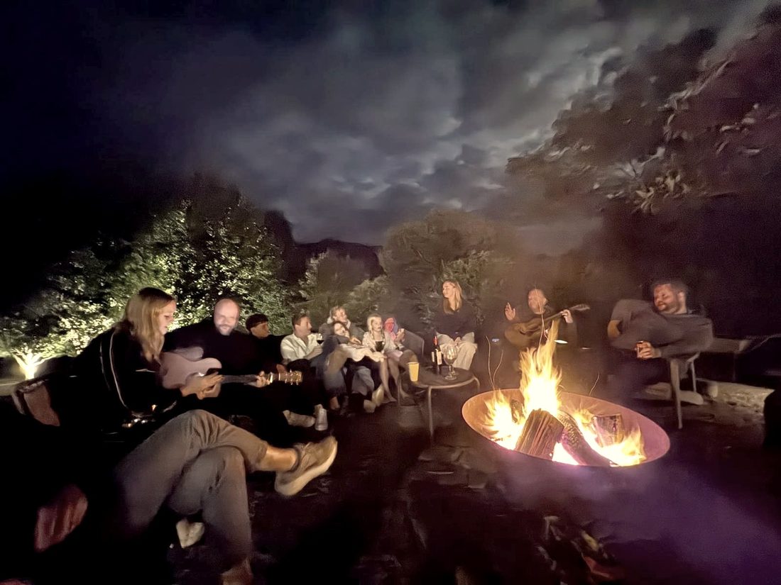 Charlie and family around the firepit at home in Berry